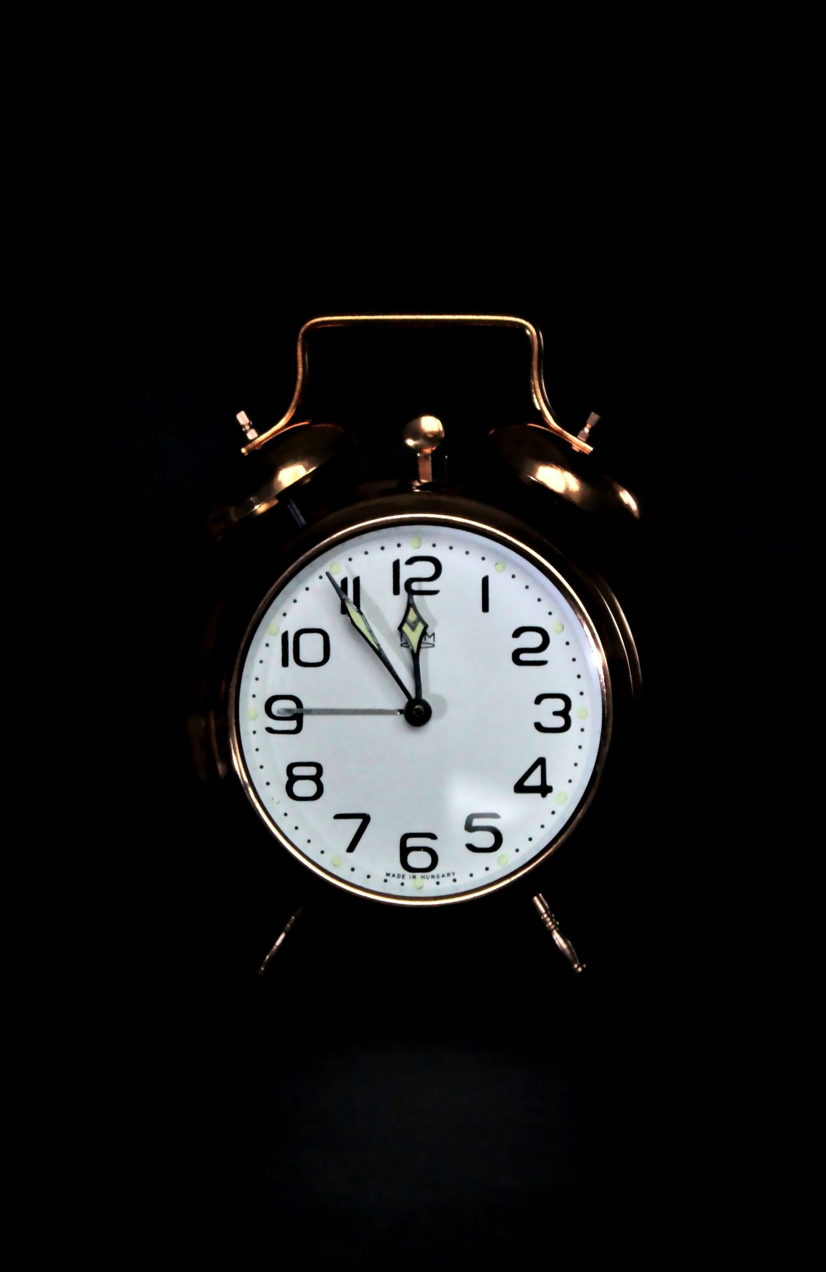 A bronze alarm clock