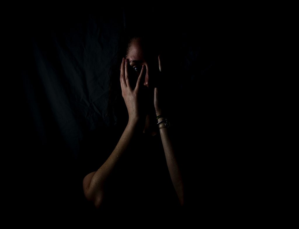 Person enveloped in darkness